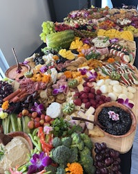 a large platter of fruits and vegetables on a table